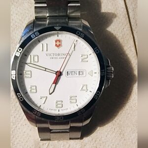 Victorinox Silver Watch with White Dial and Red Accent